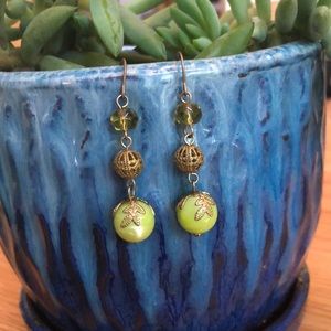 Green and gold dangle earrings